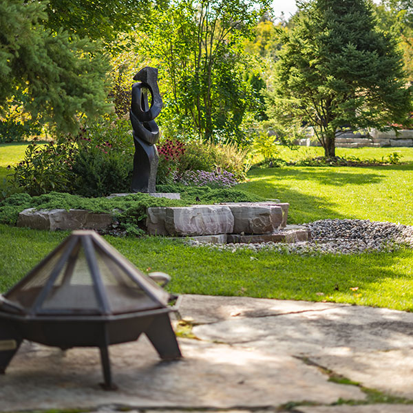 Outdoor landscape with fire pit patio ad gardens