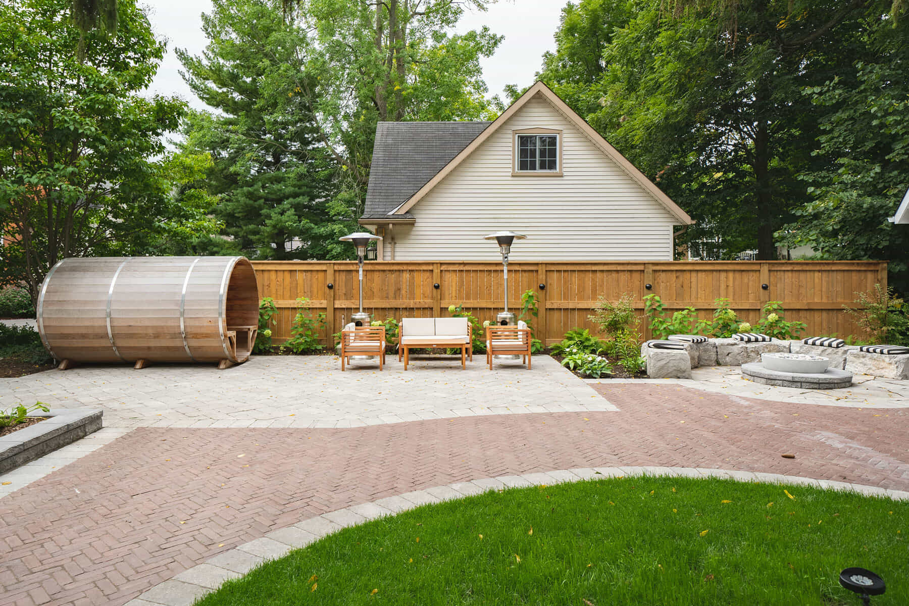 Backyard patio with interlock and sauna